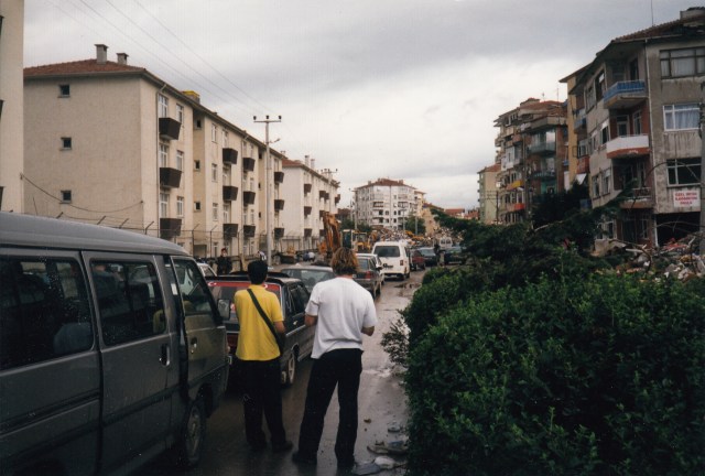 Cars stopped while searchers listen for the trapped person